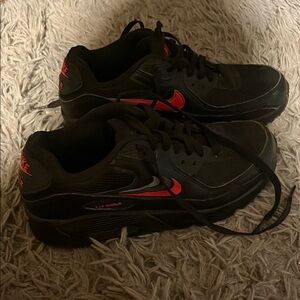 Nike Black and Red Sneakers with Iconic Swoosh